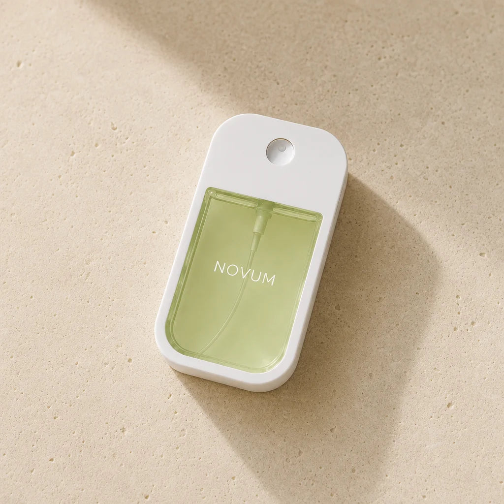 Square close product portrait of the exact NOVUM green bottle on pale textured limestone. Use a low